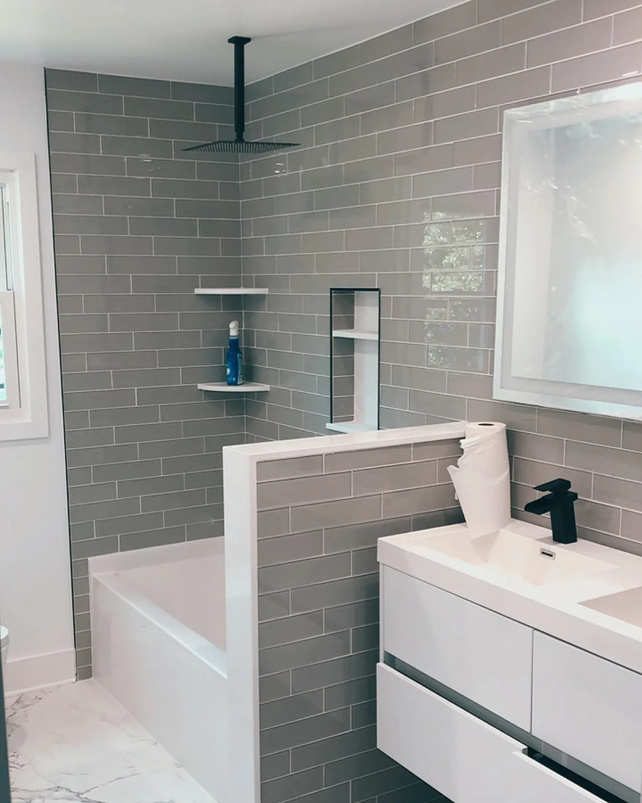 Modern gray subway tile bathroom with shower